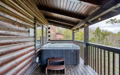 Photo 3 - Cozy Cabin Hot Tub Balcony Golf Simulator Near Pigeon Forge Smoky Mountain Group Retreat Mountains Are Calling by Avantstay