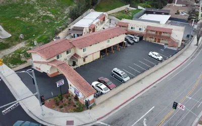 Photo 2 - New American Inn and Suites