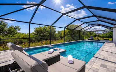 Waterfront Villa with Heated Pool & Spa, Resort-Style Lanai & Sunset Views