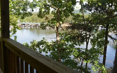 C10 - Lake view two bedroom, two bath log-sided, luxury Harbor North loft cottage with hot tub overlooking Lake Ouachita