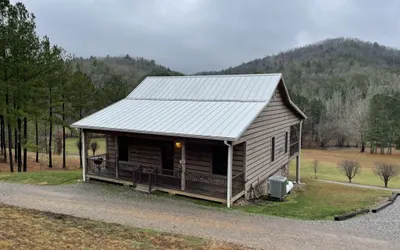 Peaceful family cabin near fishing with over 100 acres of mountain and field trails to explore!