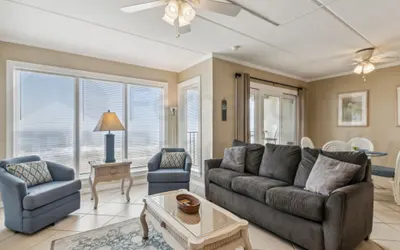 Coast View Condo Featuring Large Windows Overlooking the Beach