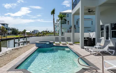 611 Sea Breeze Bliss Canal-Front Luxury: Pool, Spa & Steps to Be