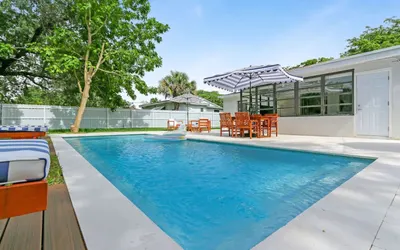 Charming 4BR Oasis with Saltwater Pool & Parking