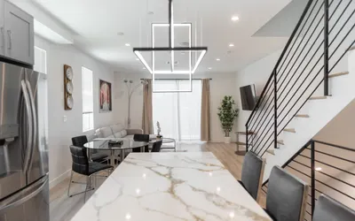 MODERN 3-4 BEDROOM TOWNHOME BUILT IN 2023 WITH OFFICE, BONUS ROOM, 2-CAR GARAGE WITH EV CHARGER & 2 BALCONIES (p63)