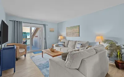 The Coastal Nest: Steps from the Beach and Poolside Relaxation