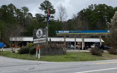 Queen Guest Room located at the Joplin Inn on the highway at the entrance to Mountain Harbor, 2 1/2 miles from Lake Ouachita. by RedAwning