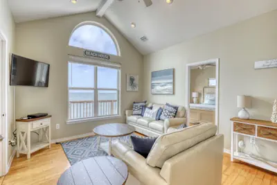 Photo 3 - Villa Delphinus - Beachfront! and Pet Friendly! Feel the ocean breezed and hear the waves lapping right at your doorstep!