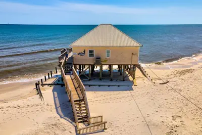 Photo 2 - Villa Delphinus - Beachfront! and Pet Friendly! Feel the ocean breezed and hear the waves lapping right at your doorstep!
