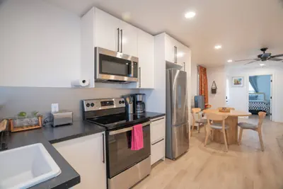 Photo 2 - Modern 3BR near downtown with fenced backyard