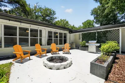 Photo 3 - 5BR Pool Home Near Beaches | Pet-Friendly + BBQ