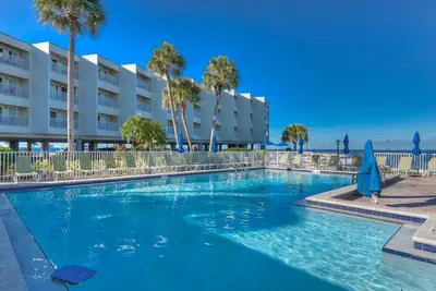 Photo 2 - 311 · Sophisticated Waterfront Getaway: Pool, Balcony, and Serene Views