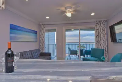 Photo 3 - Elegant Waterfront Condo with Heated Pool