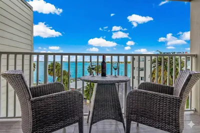 Photo 4 - Elegant Waterfront Condo with Heated Pool