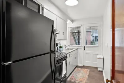 Photo 4 - Walk to High St • Free Parking & Private Backyard