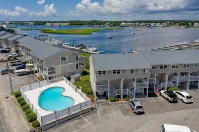 Photo 3 - Canal-Front Townhome | Private 30’ Boat Slip | Pool | 1-Min Walk to Beach