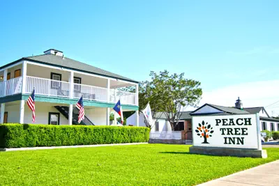 Photo 2 - Peach Tree Inn & Suites