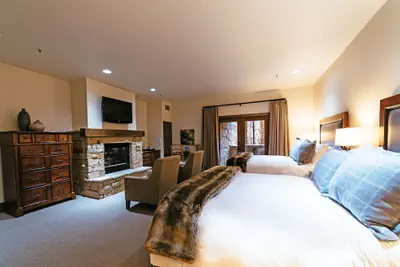 Photo 2 - Deluxe Two Queen Room With Fireplace Hotel Room by RedAwning