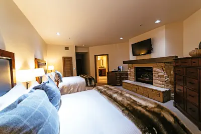 Photo 3 - Deluxe Two Queen Room With Fireplace Hotel Room by RedAwning