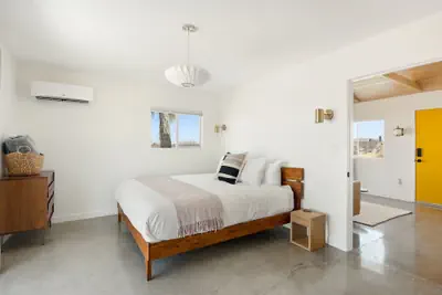 Photo 4 - Relax In Style At The Green Jackrabbit - Hot Tub, Record Player 1 Bedroom Home by RedAwning