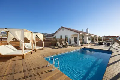 Photo 2 - Rancho Nopales Jt - Pool, Hot Tub, Hammocks, Fast Wifi + Views! 4 Bedroom Home by RedAwning