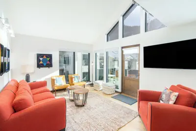 Photo 2 - Hidden Gem, 4 Min To Lift 7 Garage, Hot Tub, Lux Kitchen, Big + Bright 4 Bedroom Condo by RedAwning
