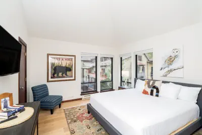 Photo 3 - Hidden Gem, 4 Min To Lift 7 Garage, Hot Tub, Lux Kitchen, Big + Bright 4 Bedroom Condo by RedAwning