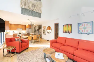 Photo 2 - Hidden Gem, 4 Min To Lift 7 Garage, Hot Tub, Lux Kitchen, Big + Bright 4 Bedroom Condo by RedAwning