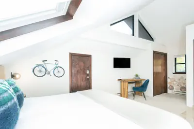 Photo 5 - Hidden Gem, 4 Min To Lift 7 Garage, Hot Tub, Lux Kitchen, Big + Bright 4 Bedroom Condo by RedAwning