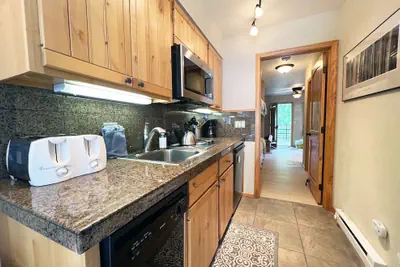 Photo 5 - Walk To Ski! Bay Window View Of River & Ski Mountain 1 Bedroom Condo by RedAwning