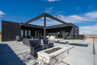 Photo 3 - Luxe Modern Escape w Pool Hot Tub Firepit Desert View Lassen by Avantstay