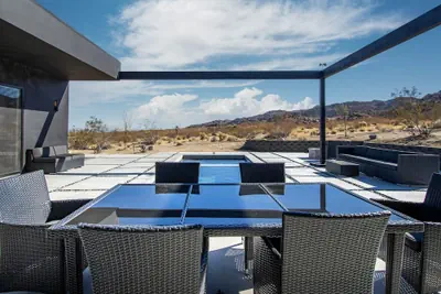 Photo 4 - Luxe Modern Escape w Pool Hot Tub Firepit Desert View Lassen by Avantstay