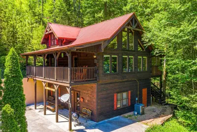 Photo 2 - Secluded 3BR Cabin w Hot Tub Dog Friendly Sleeps12