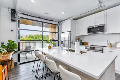 Photo 2 - Nashville Oasis at The Muse: Modern 2BR With Balcony & Rooftop Views