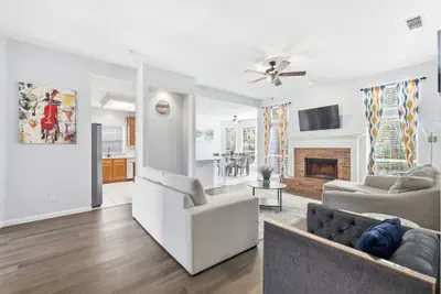 Photo 2 - Bright & Cozy 4BR Home w Movie Room & Backyard