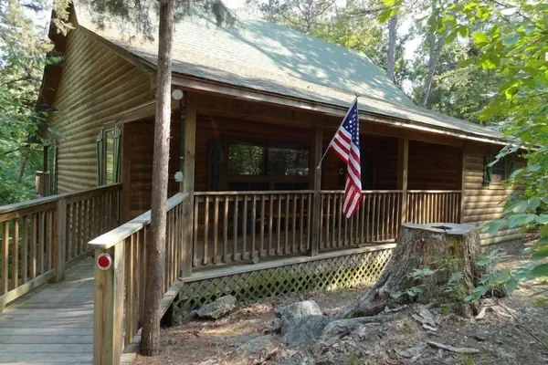 Photo 1 - One bedroom, one bath log-sided cottage with private hot tub on Lake Ouachita. by RedAwning