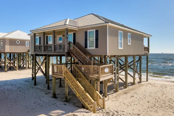 Photo 1 - KeyWester - BEACHFRONT!  Pet Friendly!  Sit on the back deck and listen to the waves crash.