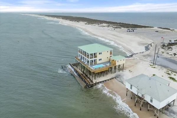 Photo 1 - Shamrock Shores - GULF FRONT west end PET FRIENDLY property with room for everyone.  3 Master suites!