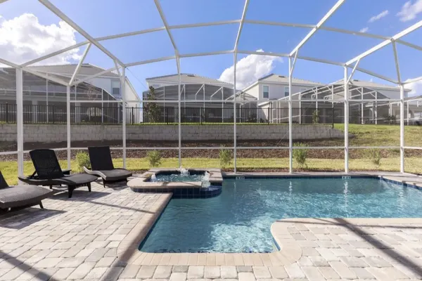Photo 1 - Refreshing 6 Bed Pool Home with Game Room Pool/Spa