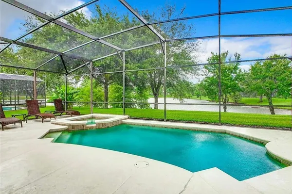 Photo 1 - Luxury 5BR Waterfront Retreat w/ Pool, Hot Tub & Game Room Near Disney