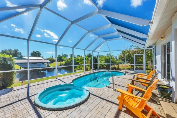 Photo 1 - Harbor Heights Private Pool Vacation Home on Canal with BBQ and Dock