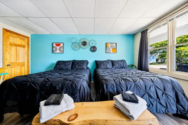 Photo 1 - Cozy Motel Stay – 2 Full Beds, Pool & Free Parking