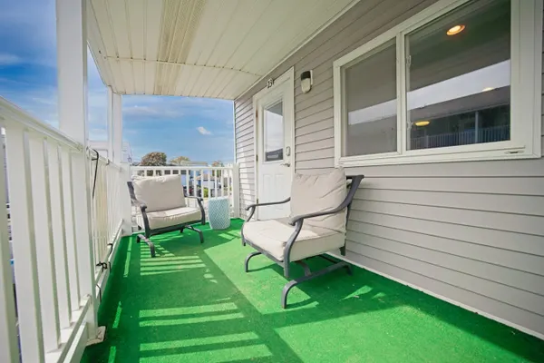 Photo 1 - Bright Coastal Escape • Steps from the Beach