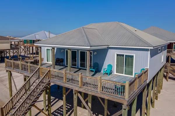 Photo 1 - Awake On The Gulf - Gulf Front! Gaze Up At The Stars From Your Large Deck While Listening To The Waves Crash. 4 Bedroom Home by RedAwning