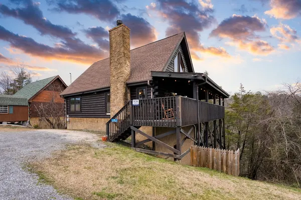Photo 1 - Cozy Cabin Hot Tub Balcony Golf Simulator Near Pigeon Forge Smoky Mountain Group Retreat Mountains Are Calling by Avantstay
