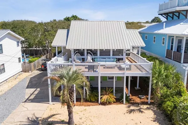 Photo 1 - Beach Retreat w/ Sundeck, Golf Cart & Bikes Bungalow House by Avantstay