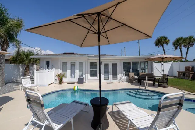 Photo 1 - Heated Pool Home Directly Across the street From Beach Close to Flagler