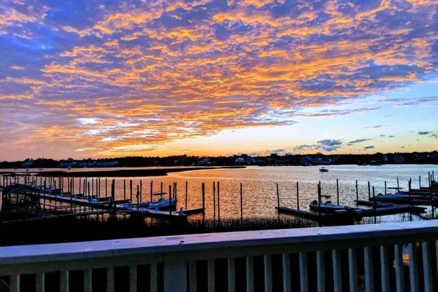 Photo 1 - Canal-Front Townhome | Private 30’ Boat Slip | Pool | 1-Min Walk to Beach