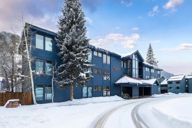 Photo 1 - Hidden Gem, 4 Min To Lift 7 Garage, Hot Tub, Lux Kitchen, Big + Bright 4 Bedroom Condo by RedAwning