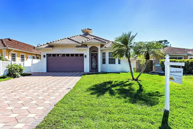 Photo 1 - Imola: Newly Remodeled Pool Home Minutes from Vanderbilt Beach. Family-Friendly Retreat with 4 BR, 3.5 Bathrooms, and Private Screened Pool. Perfect Location Near Mercato and Naples Attractions